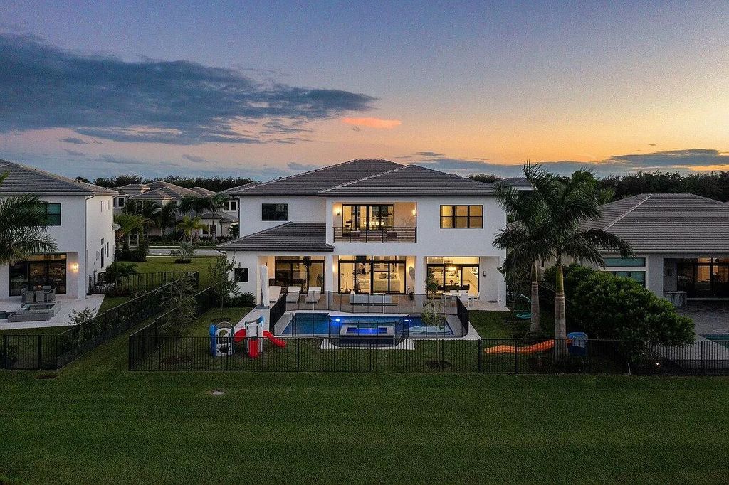 The Home in Boca Raton is a new transitional contemporary estate in the community of Boca Bridges with lake views now available for sale. This home located at 17413 Rosella Rd, Boca Raton, Florida