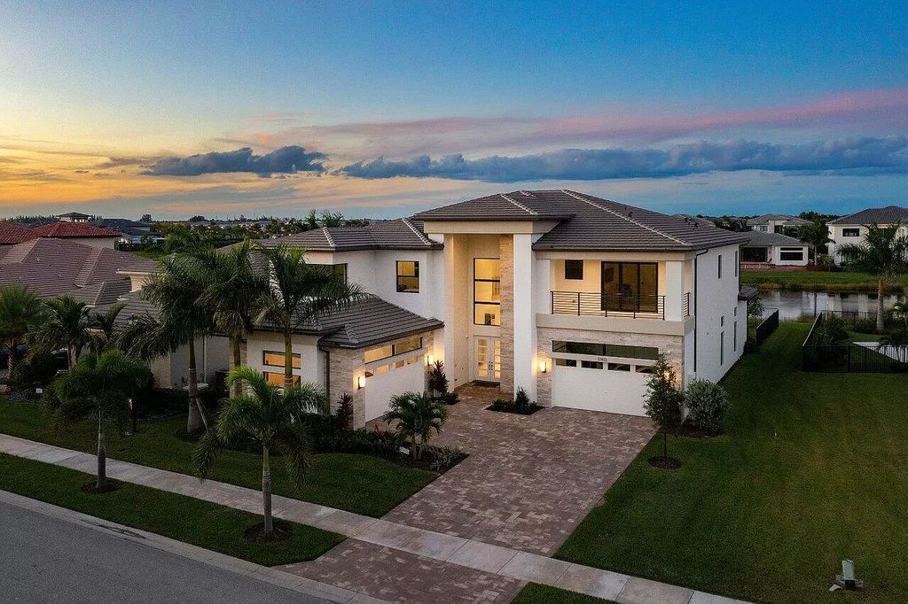 The Home in Boca Raton is a new transitional contemporary estate in the community of Boca Bridges with lake views now available for sale. This home located at 17413 Rosella Rd, Boca Raton, Florida