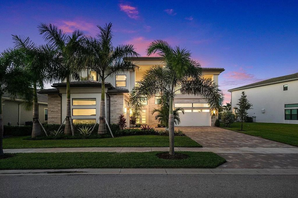 The Home in Boca Raton is a new transitional contemporary estate in the community of Boca Bridges with lake views now available for sale. This home located at 17413 Rosella Rd, Boca Raton, Florida