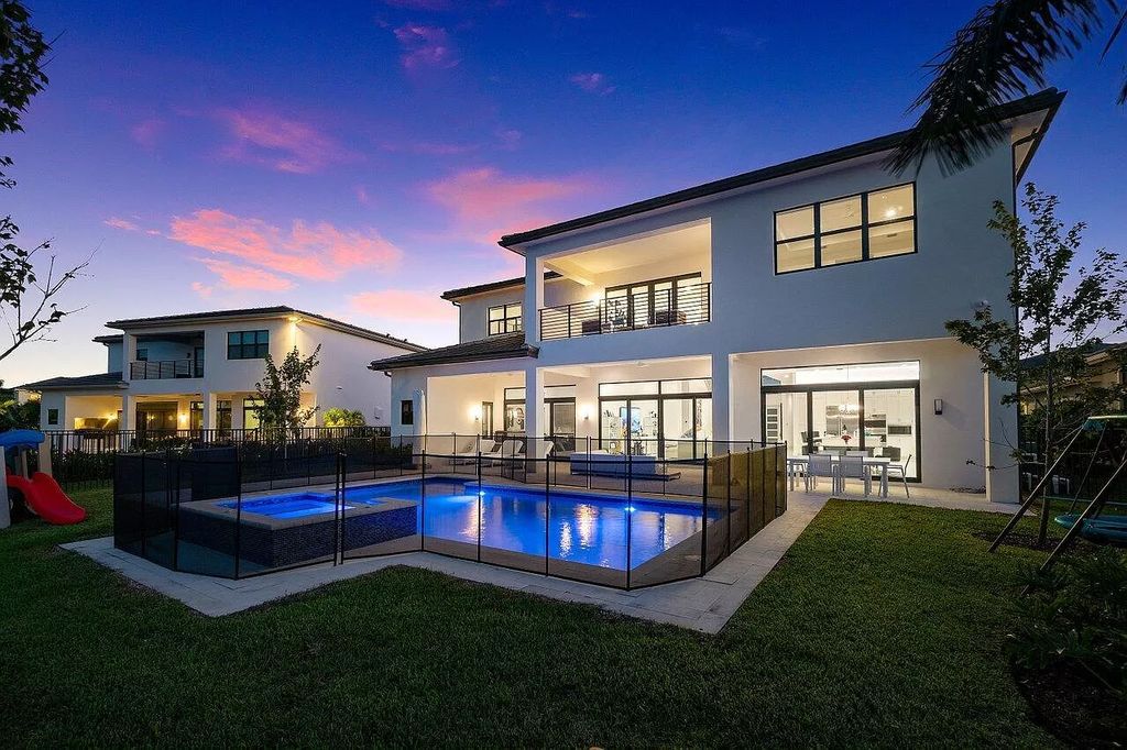 The Home in Boca Raton is a new transitional contemporary estate in the community of Boca Bridges with lake views now available for sale. This home located at 17413 Rosella Rd, Boca Raton, Florida