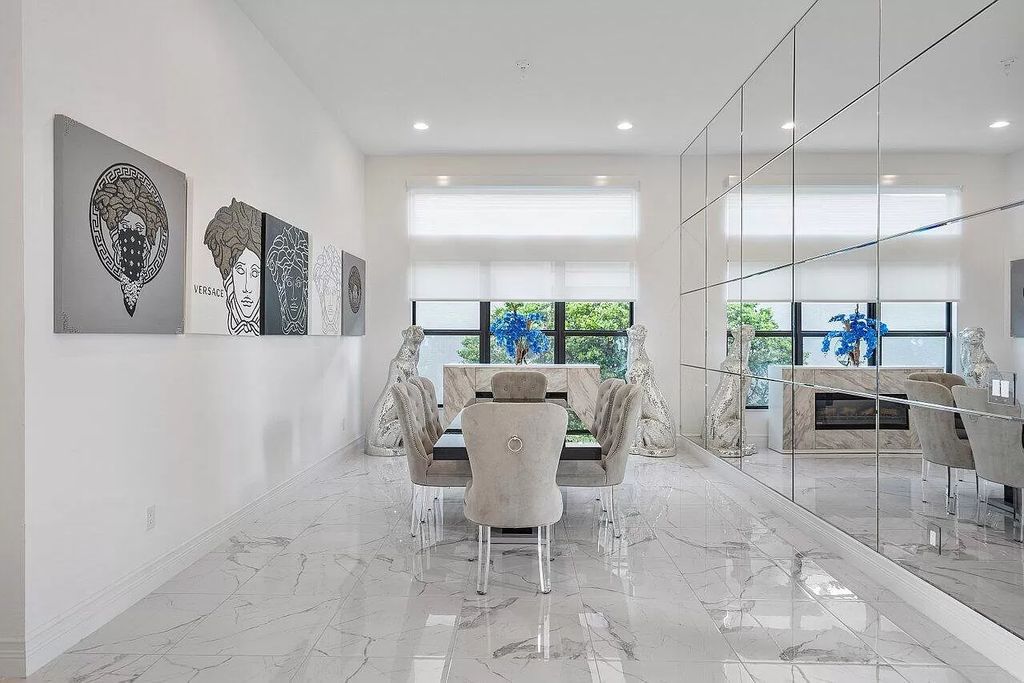 The Home in Boca Raton is a new transitional contemporary estate in the community of Boca Bridges with lake views now available for sale. This home located at 17413 Rosella Rd, Boca Raton, Florida