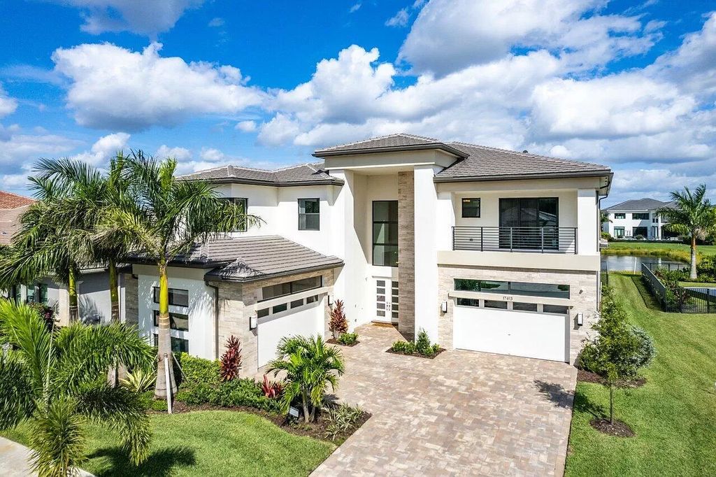 The Home in Boca Raton is a new transitional contemporary estate in the community of Boca Bridges with lake views now available for sale. This home located at 17413 Rosella Rd, Boca Raton, Florida