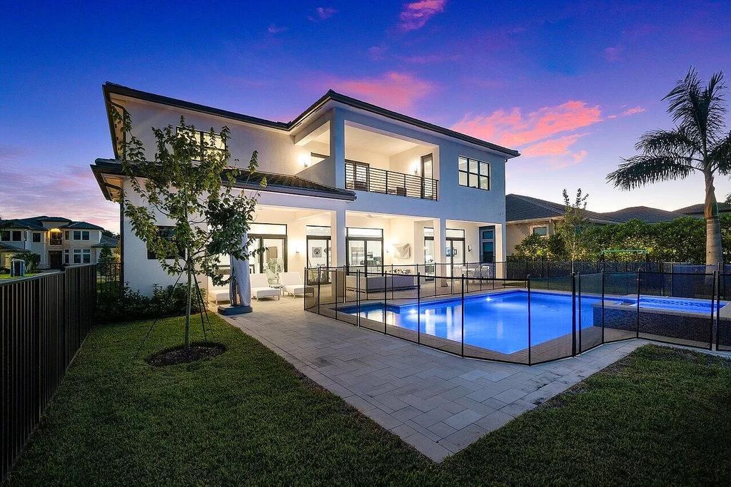 The Home in Boca Raton is a new transitional contemporary estate in the community of Boca Bridges with lake views now available for sale. This home located at 17413 Rosella Rd, Boca Raton, Florida