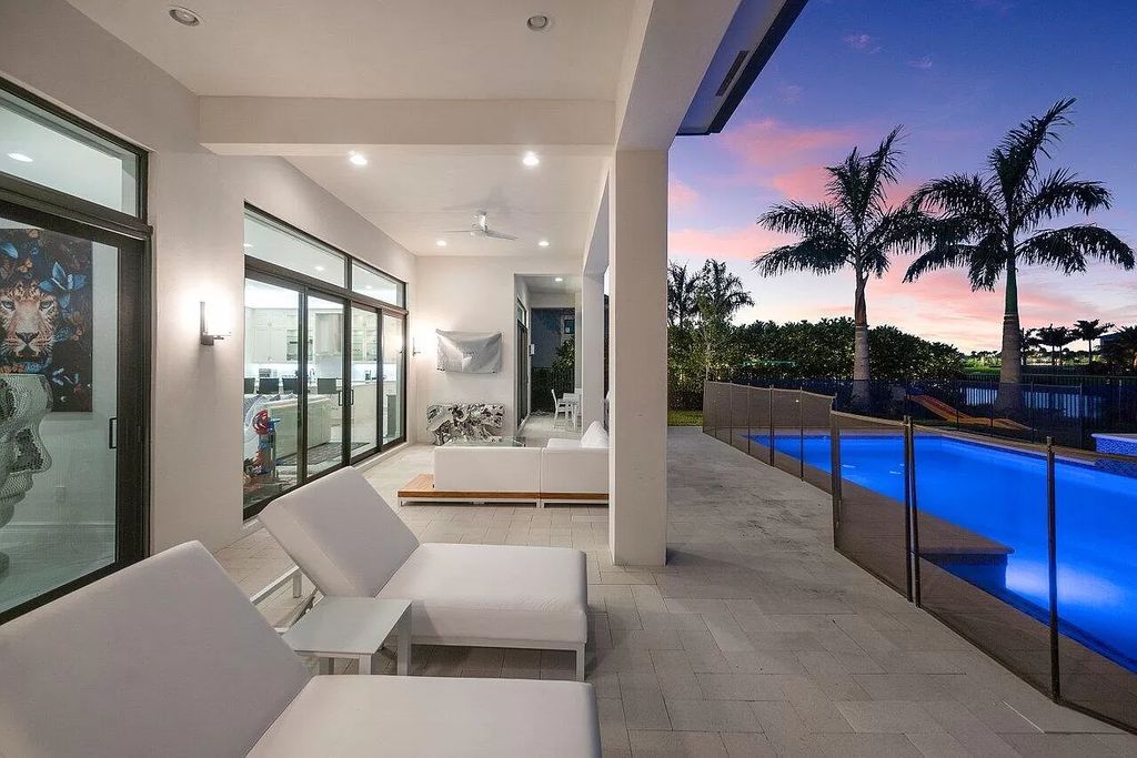 The Home in Boca Raton is a new transitional contemporary estate in the community of Boca Bridges with lake views now available for sale. This home located at 17413 Rosella Rd, Boca Raton, Florida