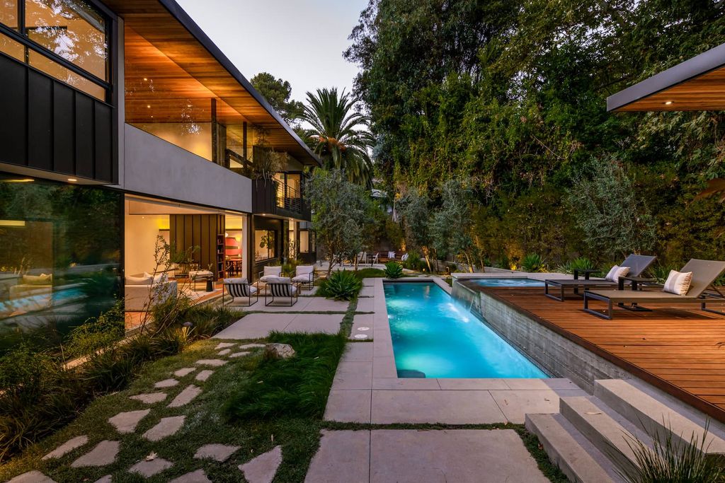 The Brentwood Home is a sustainable property completely congruent with its sublime setting designed by architect Jesse Bornstein, AIA now available for sale. This home located at 2496 Mandeville Canyon Rd, Los Angeles, California