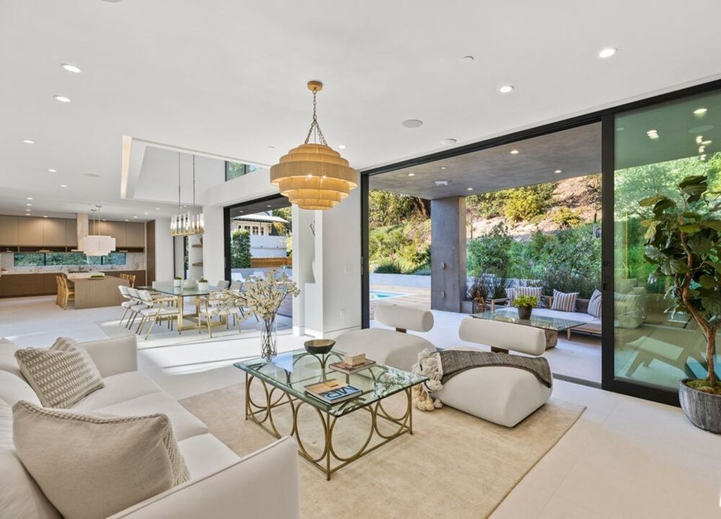 The Home in Bel Air is a stunning modern organic is nestled in a peaceful setting and surrounded by lush landscaping now available for sale. This home located at 2814 Roscomare Rd, Los Angeles, California