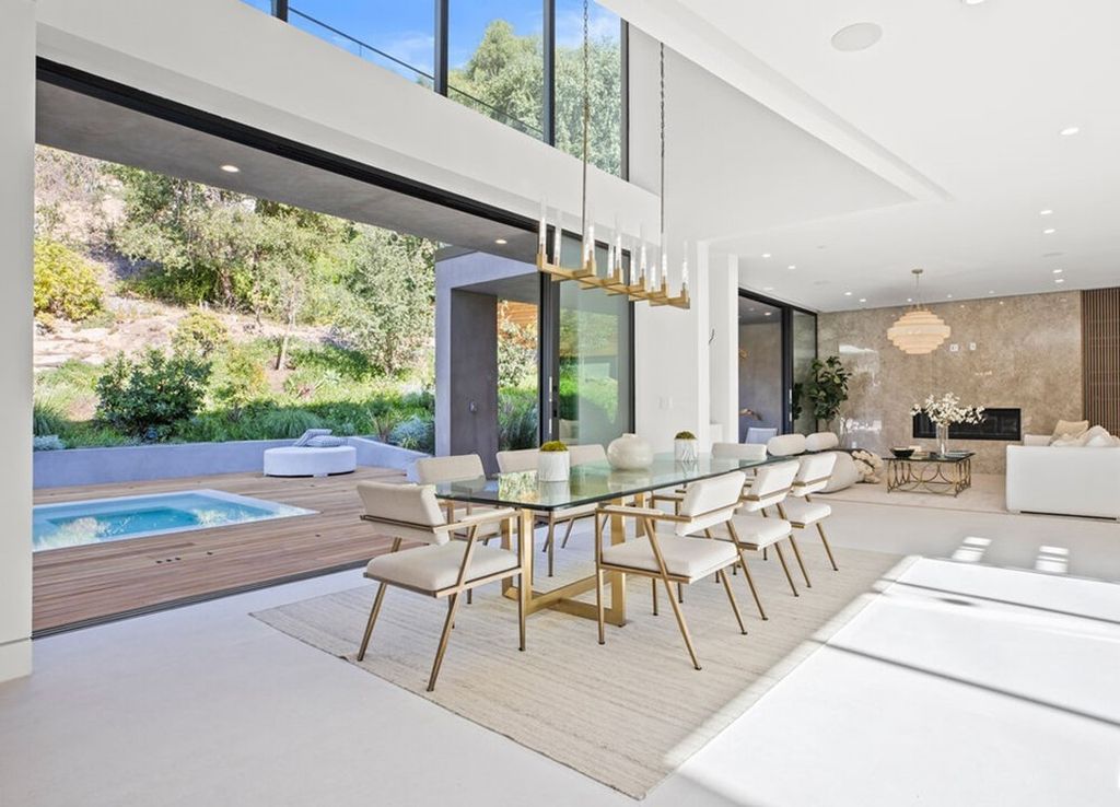 The Home in Bel Air is a stunning modern organic is nestled in a peaceful setting and surrounded by lush landscaping now available for sale. This home located at 2814 Roscomare Rd, Los Angeles, California