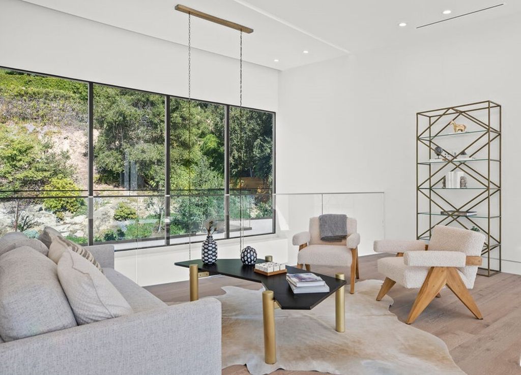 The Home in Bel Air is a stunning modern organic is nestled in a peaceful setting and surrounded by lush landscaping now available for sale. This home located at 2814 Roscomare Rd, Los Angeles, California