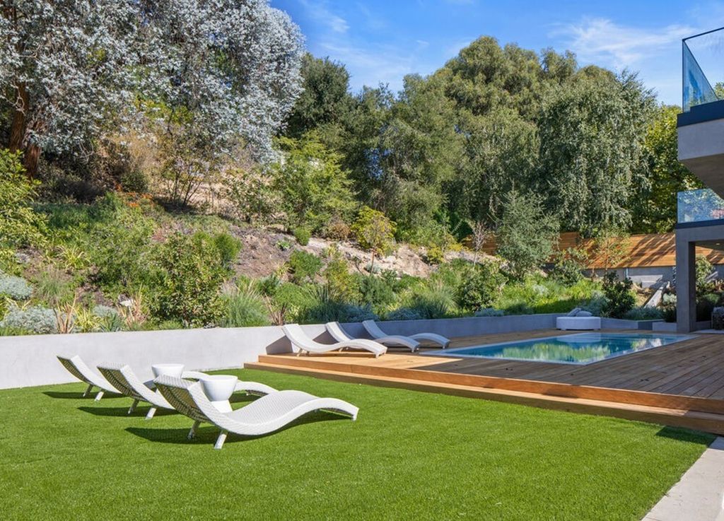 The Home in Bel Air is a stunning modern organic is nestled in a peaceful setting and surrounded by lush landscaping now available for sale. This home located at 2814 Roscomare Rd, Los Angeles, California