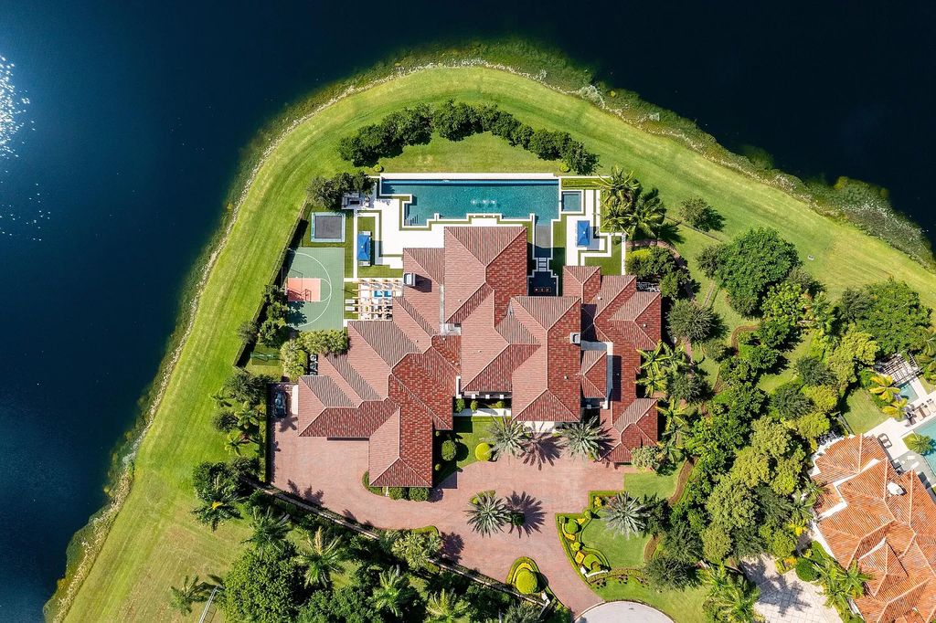 The Mansion in Weston is a seven-bedroom sanctuary by renowned architect Randall Stofft set on a prestigious gated community now available for sale. This home located at 3030 Meadow Ln, Weston, Florida