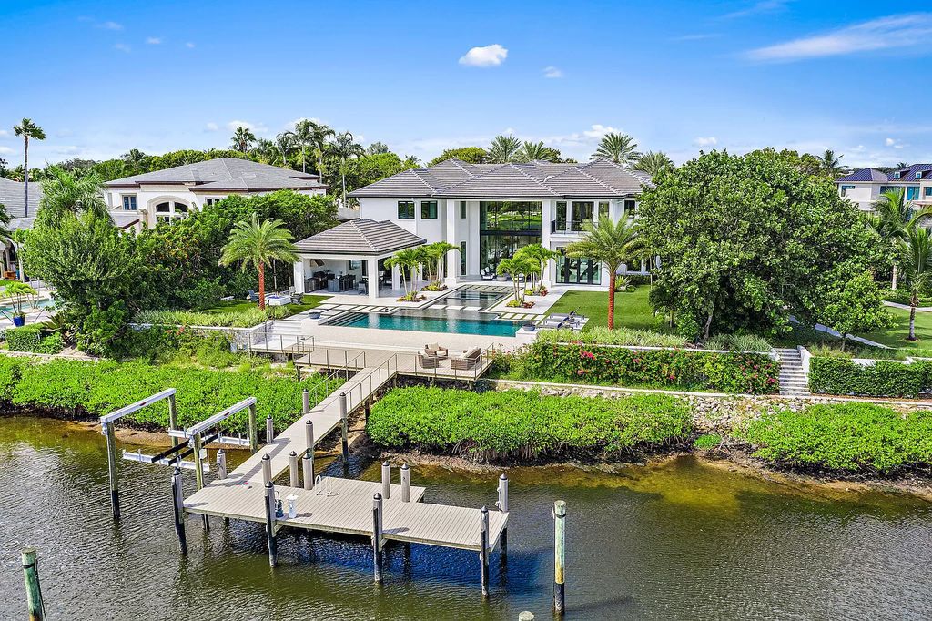 The Jupiter Mansion is a completely renovated home located in the prestigious Admirals Cove has a resort styled backyard now available for sale. This home located at 389 Eagle Dr, Jupiter, Florida