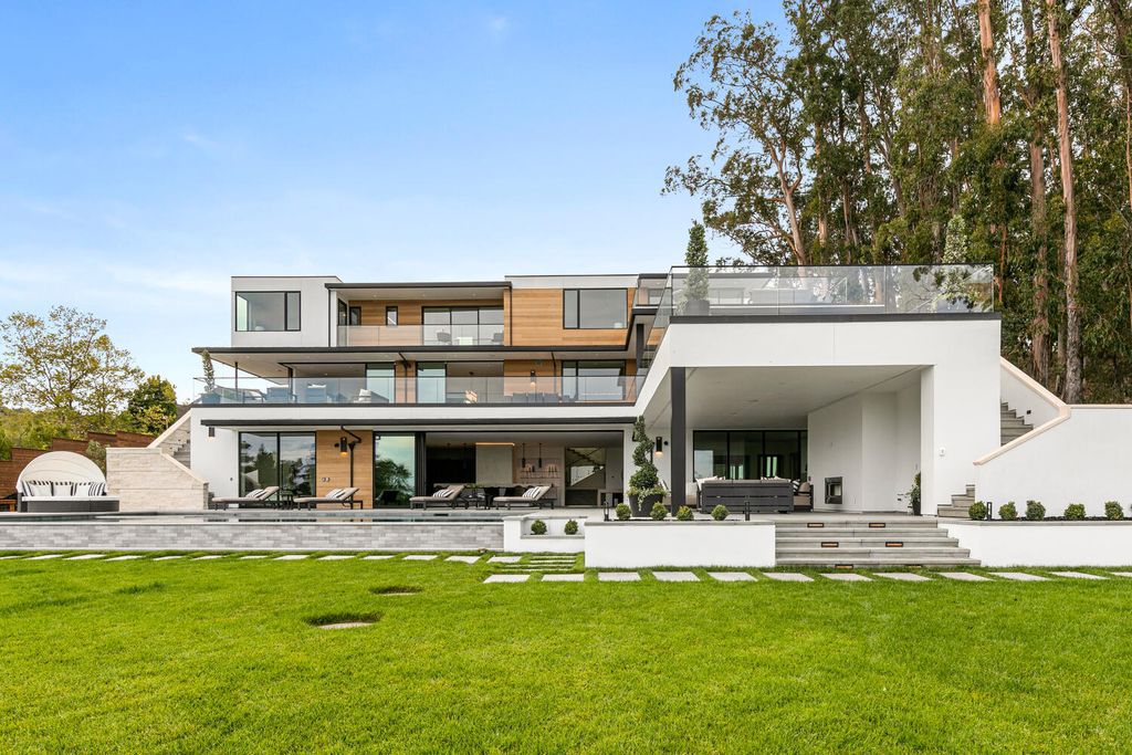 The Mansion in Hillsborough is a stunning new construction has an emphasis on sleekness, endless views and clean lines throughout now available for sale. This home located at 950 Macadamia Dr, Hillsborough, California