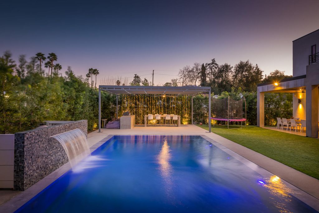 The Home in Encino features a stately entrance, with high ceilings, a favorable open floor plan and natural light illuminating the space now available for sale. This home located at 5100 Sophia Ave, Encino, California