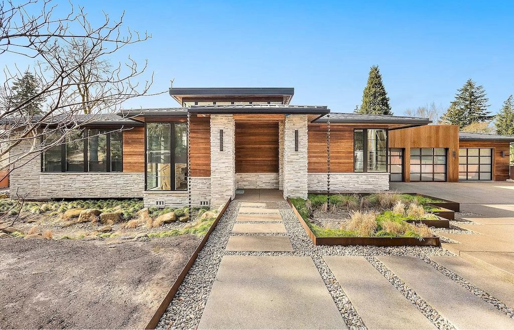 The Warm Elegance Modern House in Oregon abounds natural light now available for sale. This home is located at 5185 Carman Dr, Lake Oswego, Oregon