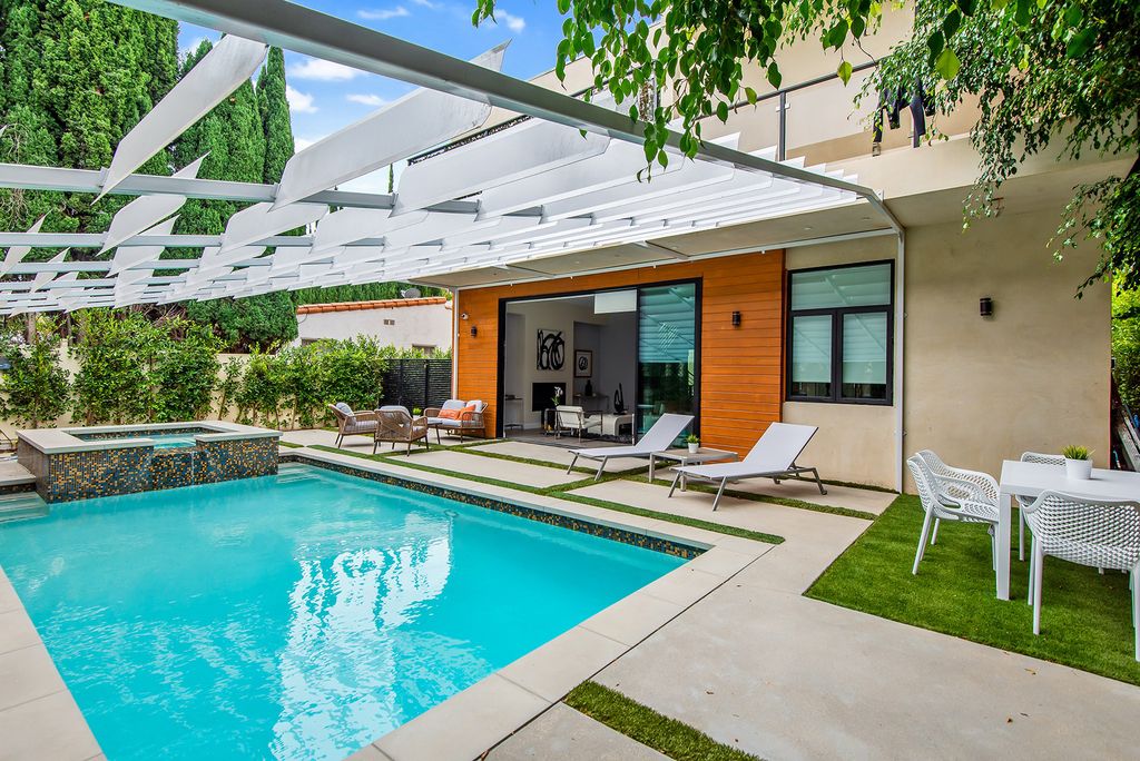 The Home in Beverly Hills is a beautiful modern contemporary residence with open floor plan and high ceilings throughout now available for sale. This home located at 156 N Wetherly Dr, Beverly Hills, California