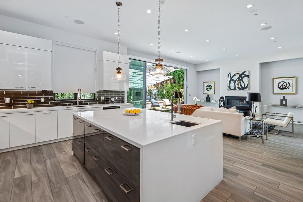The Home in Beverly Hills is a beautiful modern contemporary residence with open floor plan and high ceilings throughout now available for sale. This home located at 156 N Wetherly Dr, Beverly Hills, California