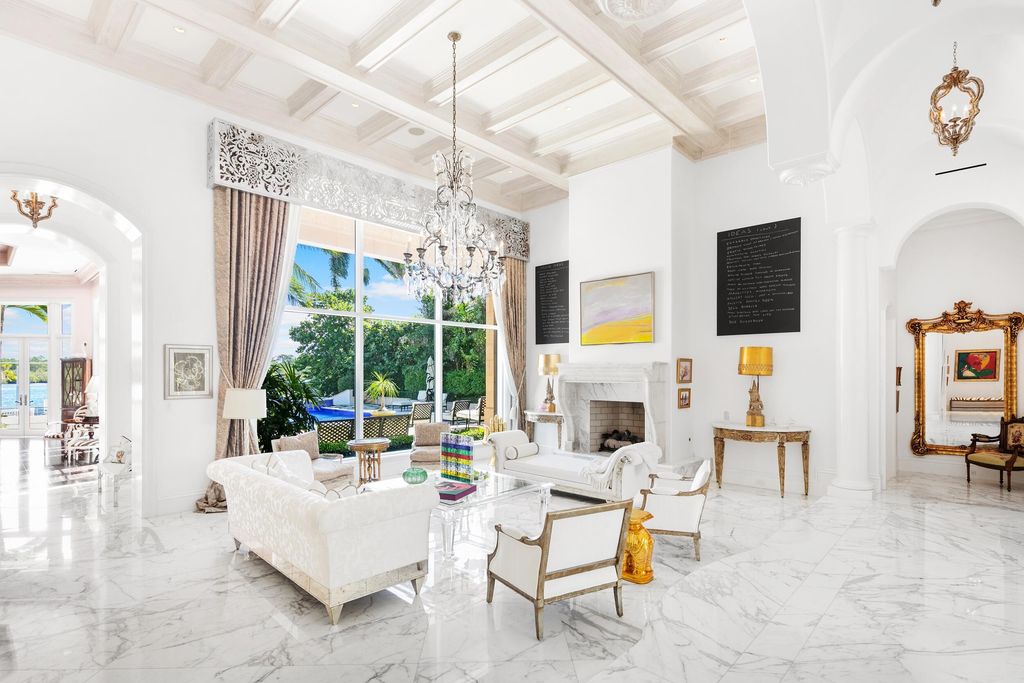 The Jupiter Mansion is a palatial estate nestled quietly among the supreme privacy of Jupiter’s coveted Admiral’s Cove now available for sale. This home located at 372 Regatta Dr, Jupiter, Florida