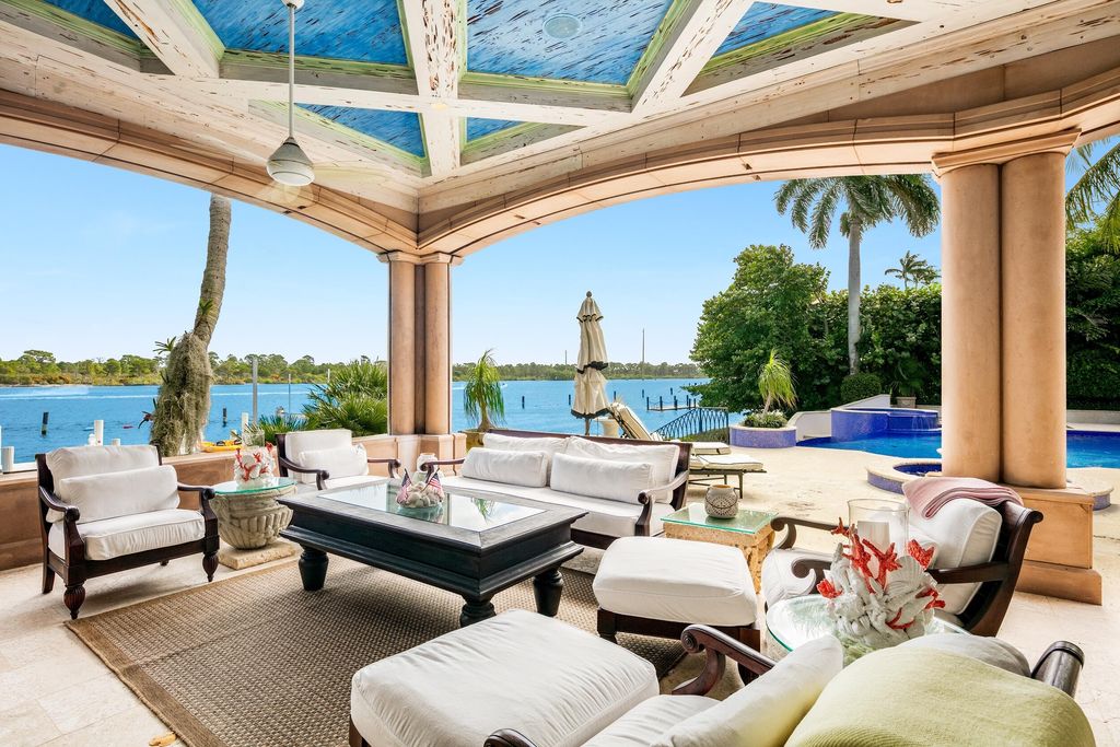 The Jupiter Mansion is a palatial estate nestled quietly among the supreme privacy of Jupiter’s coveted Admiral’s Cove now available for sale. This home located at 372 Regatta Dr, Jupiter, Florida