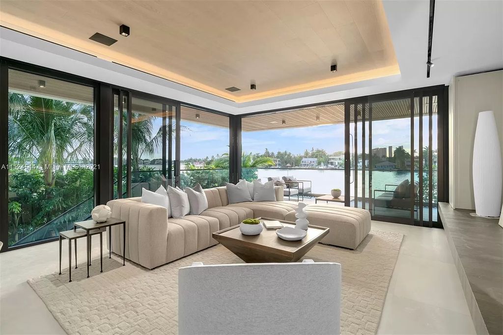 The Home in Miami Beach is a brand new tropical modern residence showcases a series of architectural moments, seamless indoor outdoor living now available for sale. This house located at 40 W Rivo Alto Dr, Miami Beach, Florida