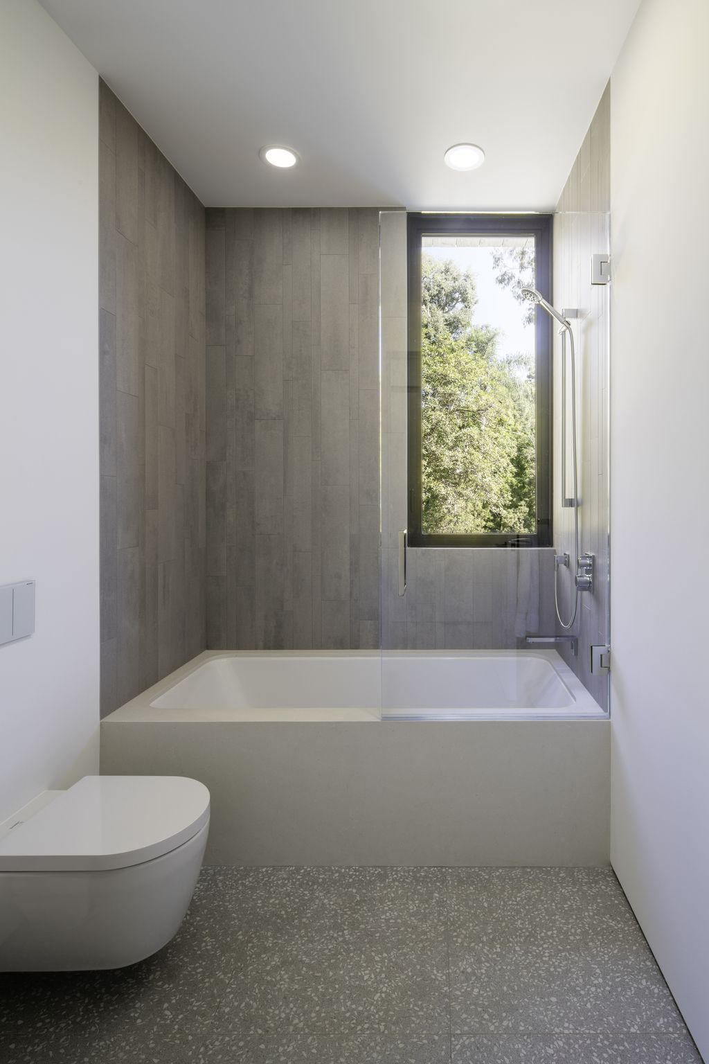 If you're looking to create a serene and calming bathroom, consider minimalist gray bathroom ideas. Gray is a timeless and versatile color that can be paired with a variety of other colors to create a unique and sophisticated look. A minimalist approach to gray bathroom design involves incorporating simple and sleek fixtures, such as a floating vanity, a frameless shower door, and minimalist lighting. To add texture and interest, consider using gray tiles with different finishes, such as matte and glossy