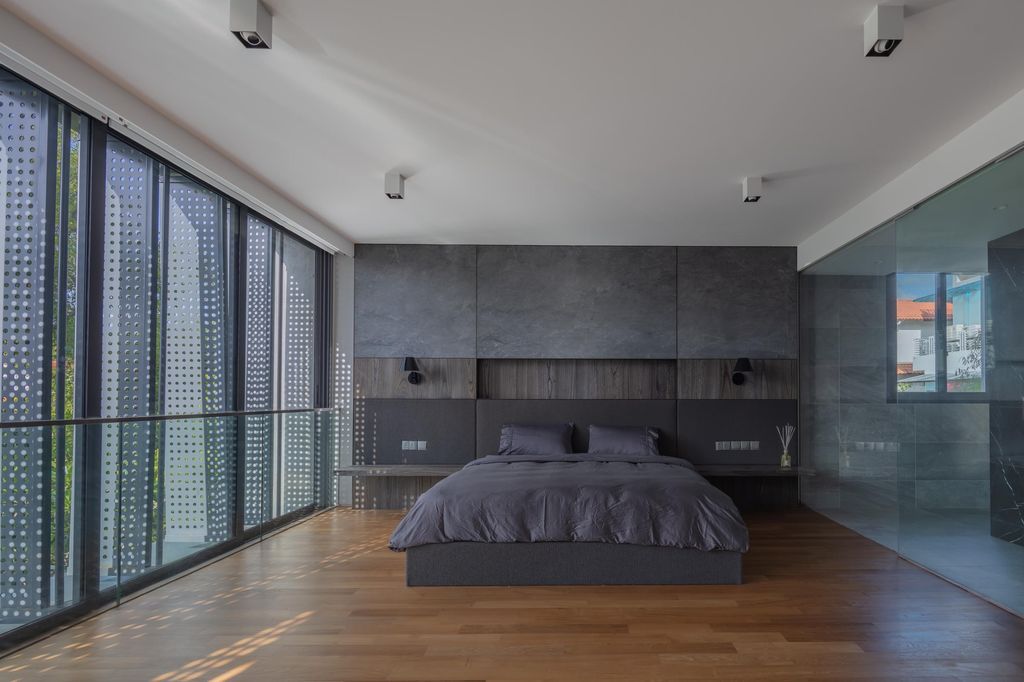 Despite the cool color scheme, this modern bedroom doesn't seem chilly at all. With gray bedding, this monochrome space is completely contemporary. Making your bedroom monochromatic is a really simple method to upgrade it. Just keep in mind: To give your area more dimension, employ a variety of hues and tones of the color you've chosen.