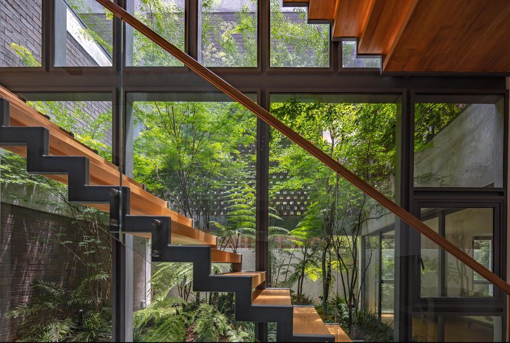 Green Revelation House Enveloped by Lush Gardens by HYLA Architects