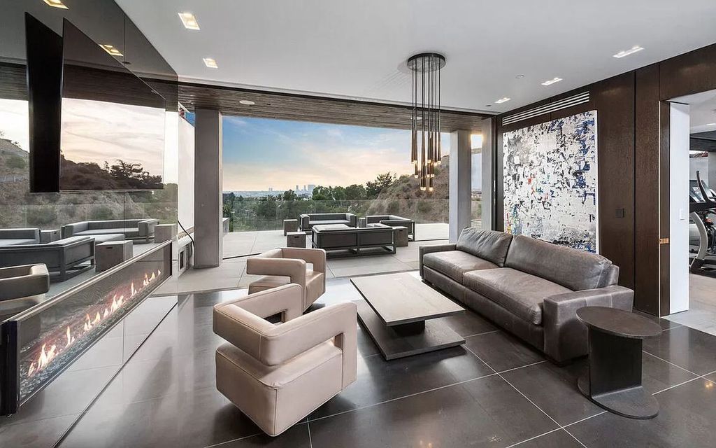 The Los Angeles Modern Mansion is a stunning new construction, truly unique warm contemporary architectural provides unmatched security and privacy now available for sale. This home located at 1871 N Stanley Ave, Los Angeles, California