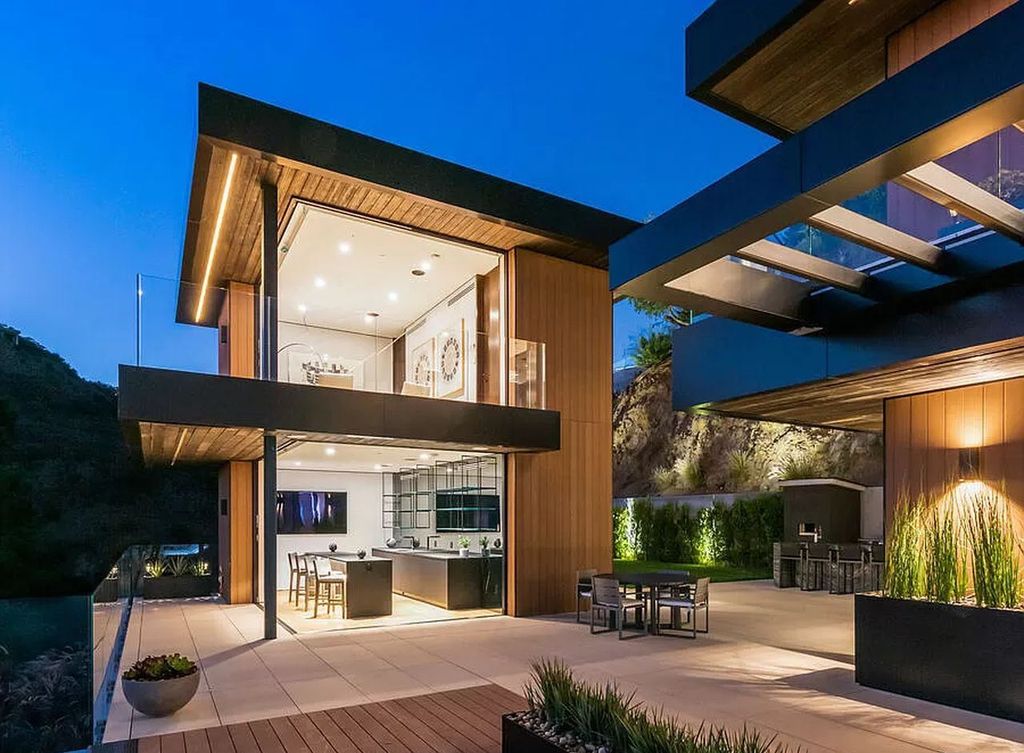 The Los Angeles Modern Mansion is a stunning new construction, truly unique warm contemporary architectural provides unmatched security and privacy now available for sale. This home located at 1871 N Stanley Ave, Los Angeles, California