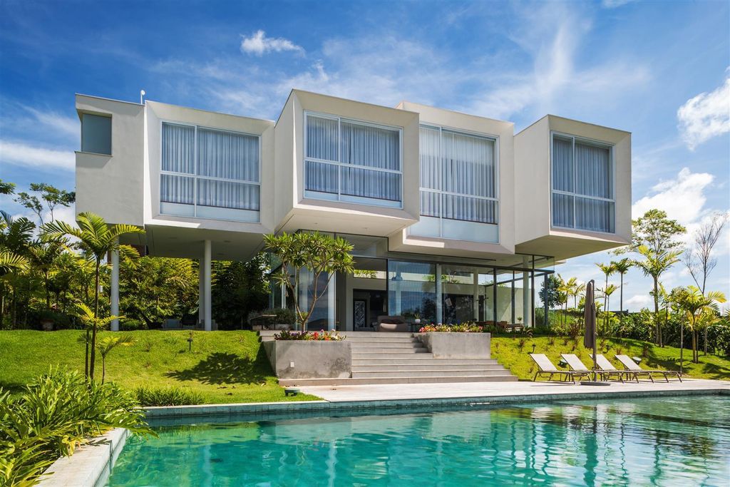 Neblina house, stunning white volumes on sloping plot by FGMF Arquitetos