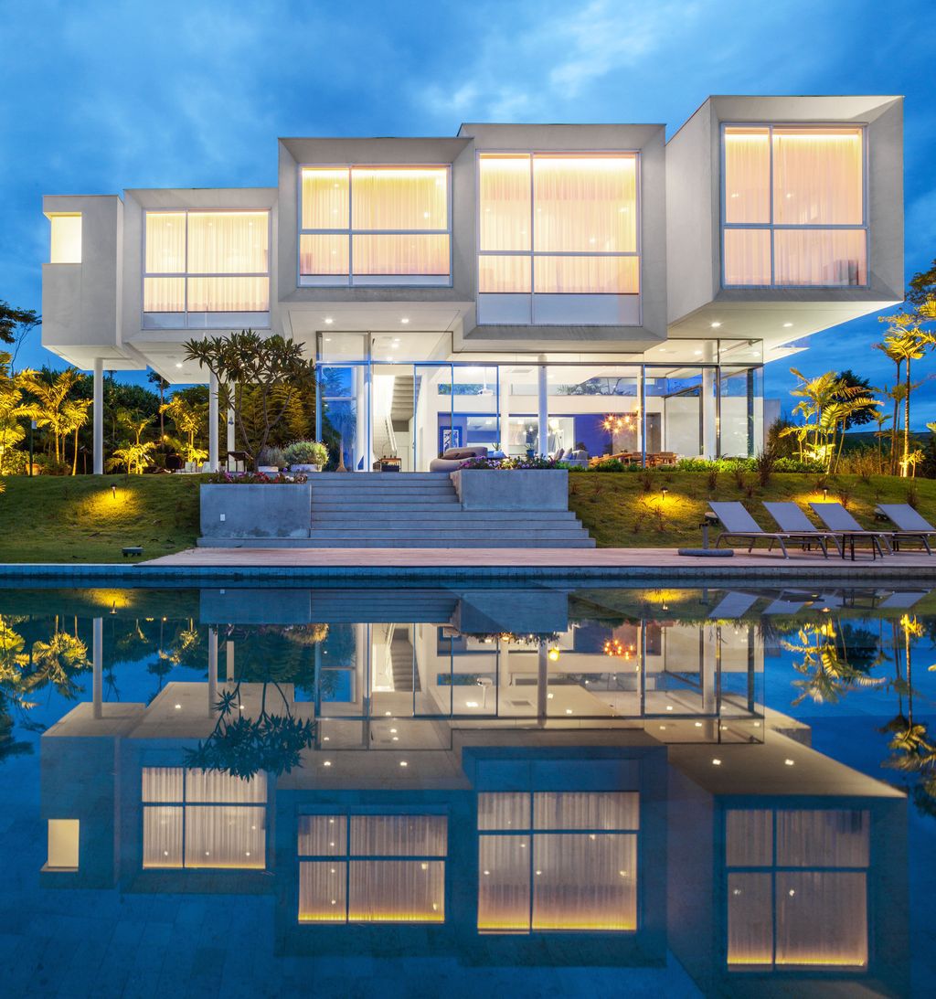 Neblina house, stunning white volumes on sloping plot by FGMF Arquitetos