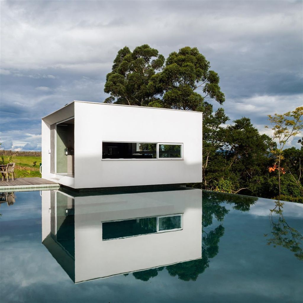 Neblina house, stunning white volumes on sloping plot by FGMF Arquitetos