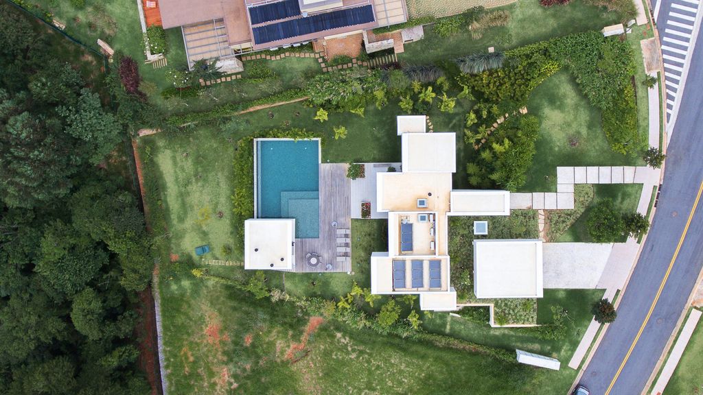 Neblina house, stunning white volumes on sloping plot by FGMF Arquitetos