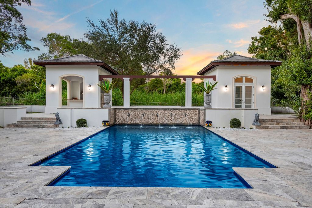 The Villa in Miami is a Palatial Neoclassical Estate on 1.2 park-like acres in guard-gated Snapper Creek Lakes now available for sale. This home located at 5225 Fairchild Way, Miami, Florida