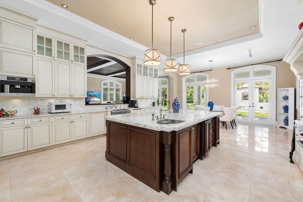 The Villa in Miami is a Palatial Neoclassical Estate on 1.2 park-like acres in guard-gated Snapper Creek Lakes now available for sale. This home located at 5225 Fairchild Way, Miami, Florida