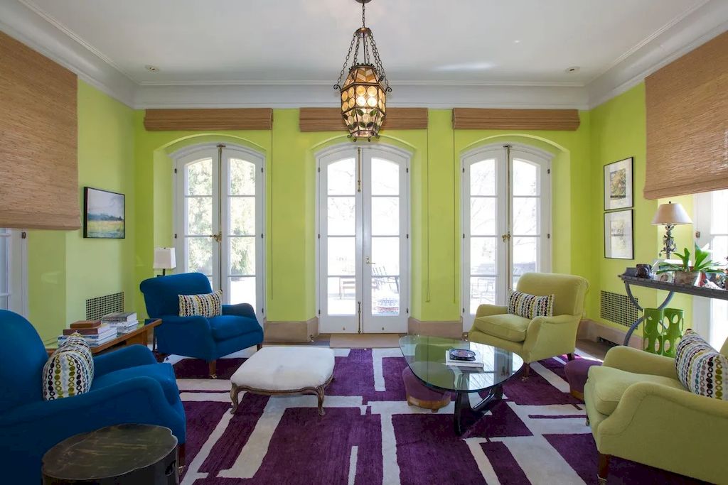 The combination of varied colors while preserving a traditional style is remarkable in this photo. This smaill room has a natural feel to it with a small amount of furnishings. As you can see, the four single couches are situated in four corners of the room, leaving the least amount of space for a little spot tree.