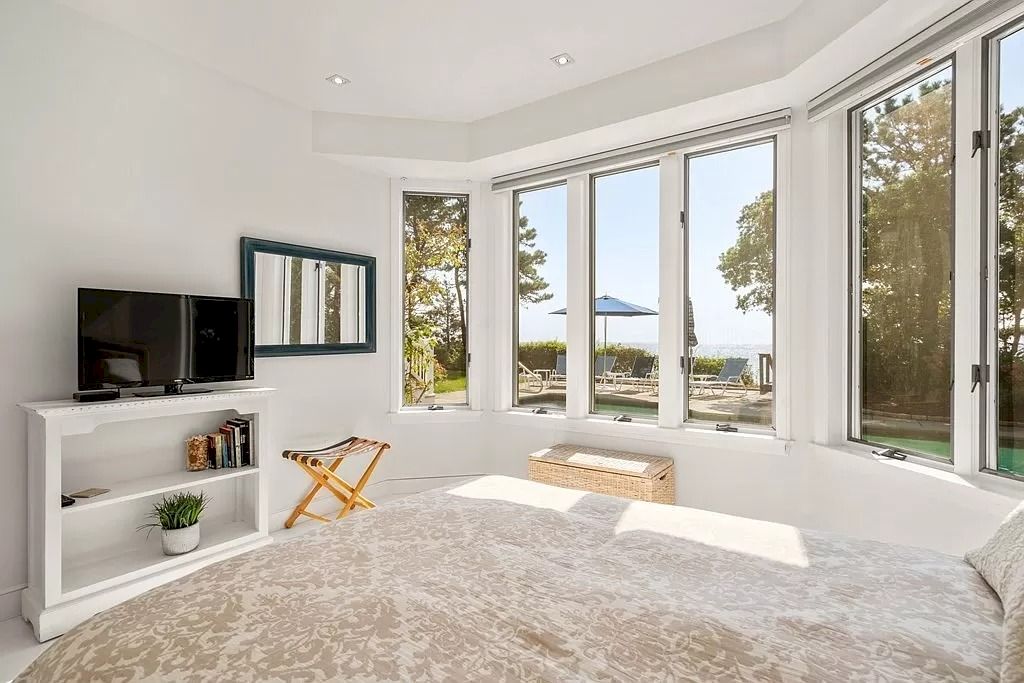 The Perfect Beachfront Home is a luxurious home now available for sale. This home located at 27 Ocean Bluff Dr, Mashpee, Massachusetts; offering 06 bedrooms and 08 bathrooms with 4,220 square feet of living spaces.