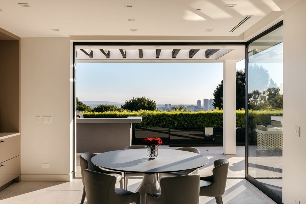 The Home in Beverly Hills is a contemporary masterpiece is built with soaring ceilings, clean lines, and sleek intricacies now available for sale. This home located at 1041 N Hillcrest Rd, Beverly Hills, California