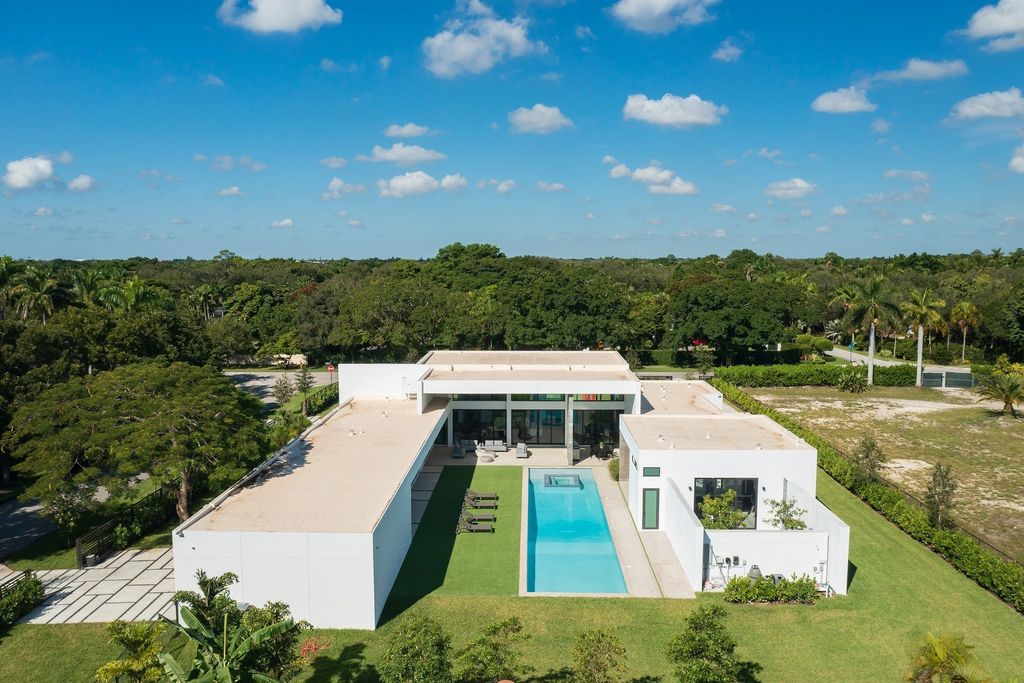 The Home in Miami is a brand new modern masterpiece built with the finest finishes and multiple water features now available for sale. This home located at 6645 SW 116th St, Miami, Florida