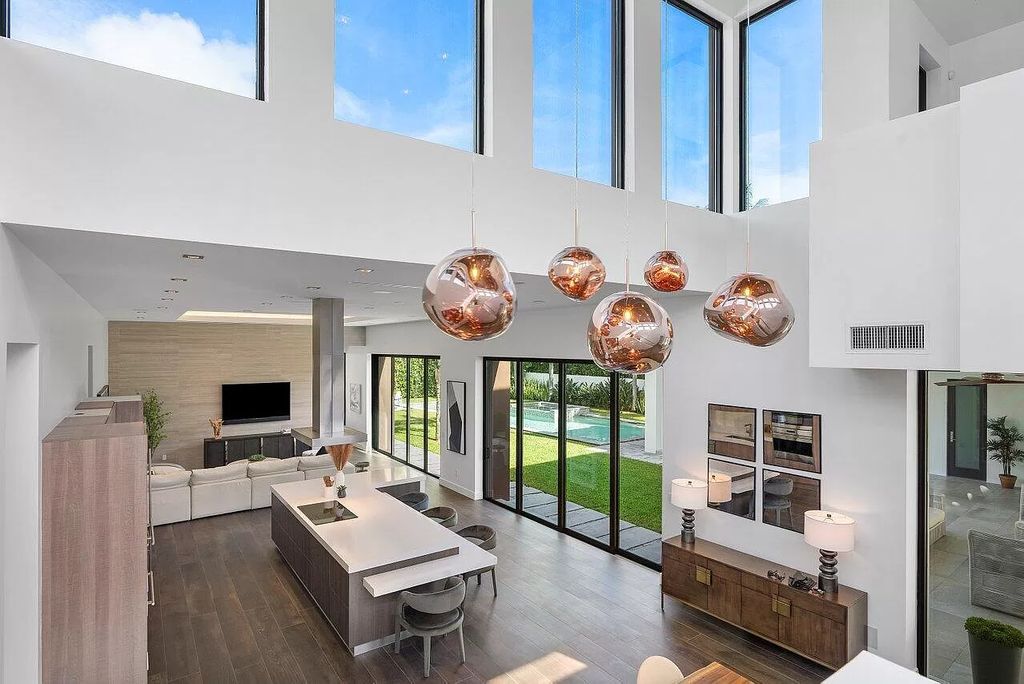 The Home in Boca Raton is a stunning contemporary custom home by award winning Affiniti Architects & CDC Builders now available for sale. This house located at 383 Thatch Palm Dr, Boca Raton, Florida