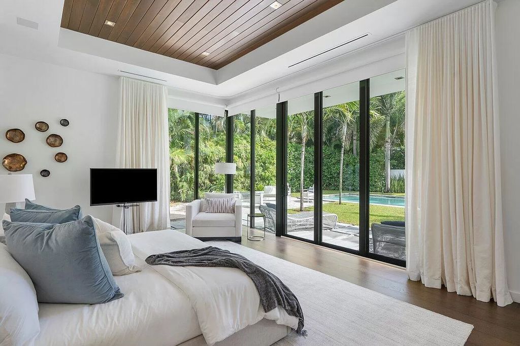 The Home in Boca Raton is a stunning contemporary custom home by award winning Affiniti Architects & CDC Builders now available for sale. This house located at 383 Thatch Palm Dr, Boca Raton, Florida