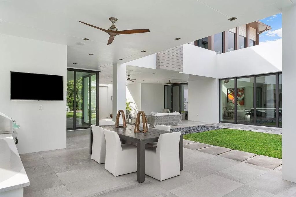 The Home in Boca Raton is a stunning contemporary custom home by award winning Affiniti Architects & CDC Builders now available for sale. This house located at 383 Thatch Palm Dr, Boca Raton, Florida