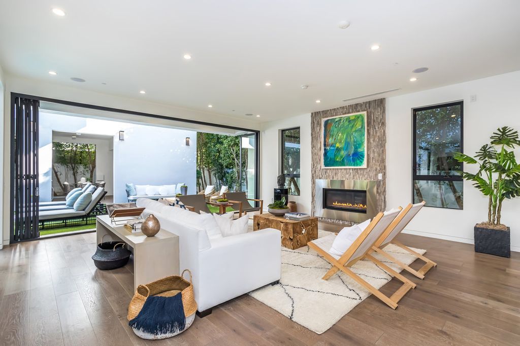 The Home in Los Angeles is a Stunning contemporary home gated for privacy on a prime street in the highly regarded Melrose Village now available for sale. This Estate located at 836 N Ogden Dr, Los Angeles