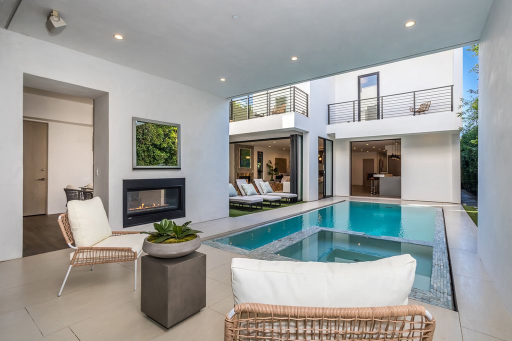 The Home in Los Angeles is a Stunning contemporary home gated for privacy on a prime street in the highly regarded Melrose Village now available for sale. This Estate located at 836 N Ogden Dr, Los Angeles