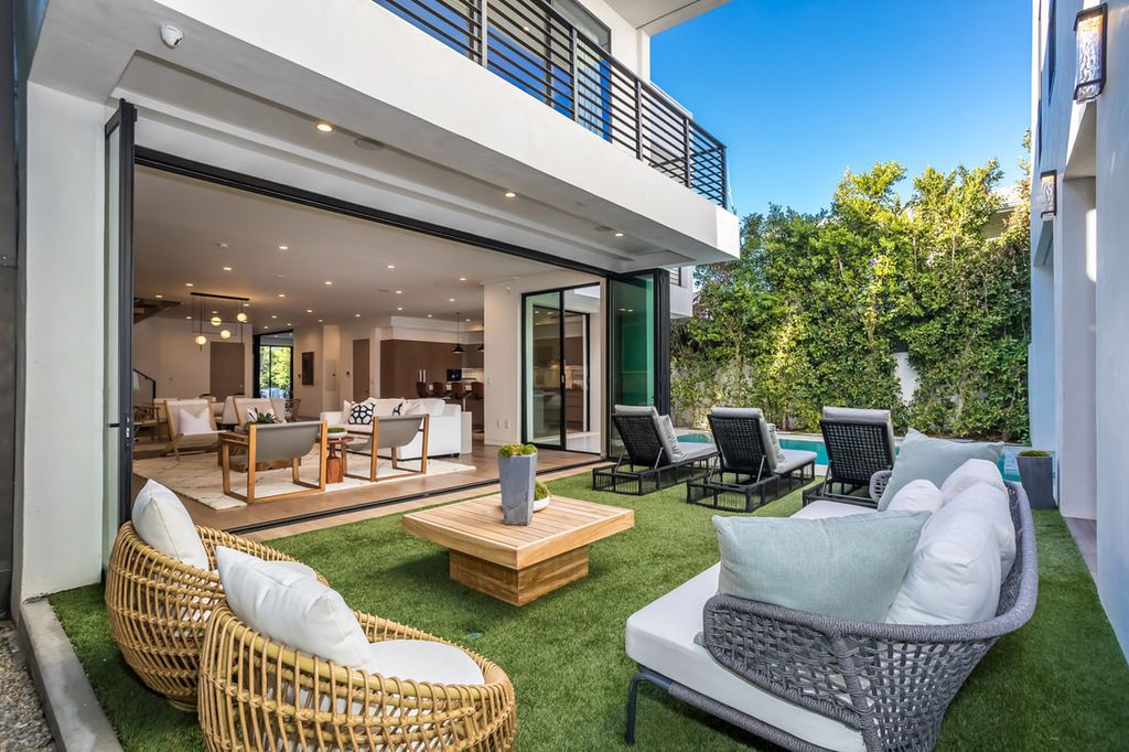 The Home in Los Angeles is a Stunning contemporary home gated for privacy on a prime street in the highly regarded Melrose Village now available for sale. This Estate located at 836 N Ogden Dr, Los Angeles