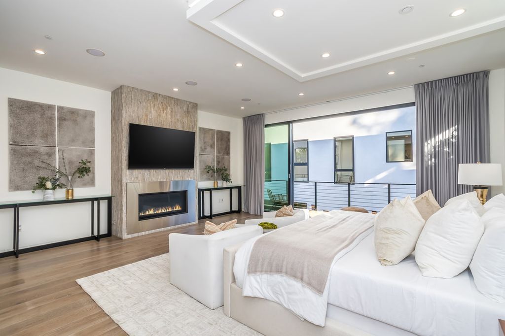 The Home in Los Angeles is a Stunning contemporary home gated for privacy on a prime street in the highly regarded Melrose Village now available for sale. This Estate located at 836 N Ogden Dr, Los Angeles