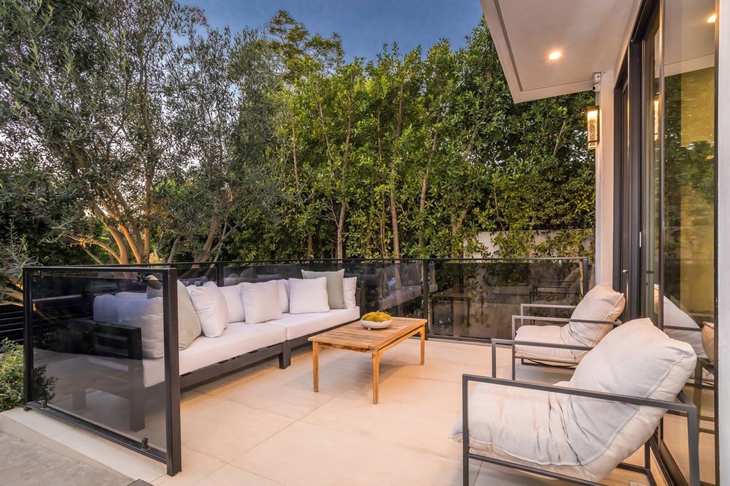 The Home in Los Angeles is a Stunning contemporary home gated for privacy on a prime street in the highly regarded Melrose Village now available for sale. This Estate located at 836 N Ogden Dr, Los Angeles