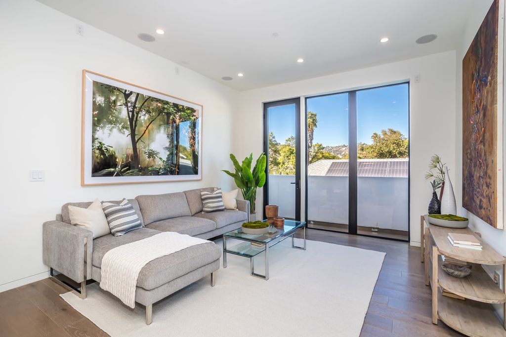 The Home in Los Angeles is a Stunning contemporary home gated for privacy on a prime street in the highly regarded Melrose Village now available for sale. This Estate located at 836 N Ogden Dr, Los Angeles