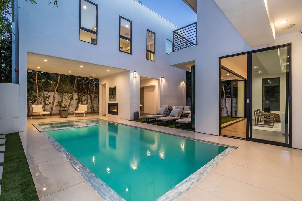 The Home in Los Angeles is a Stunning contemporary home gated for privacy on a prime street in the highly regarded Melrose Village now available for sale. This Estate located at 836 N Ogden Dr, Los Angeles