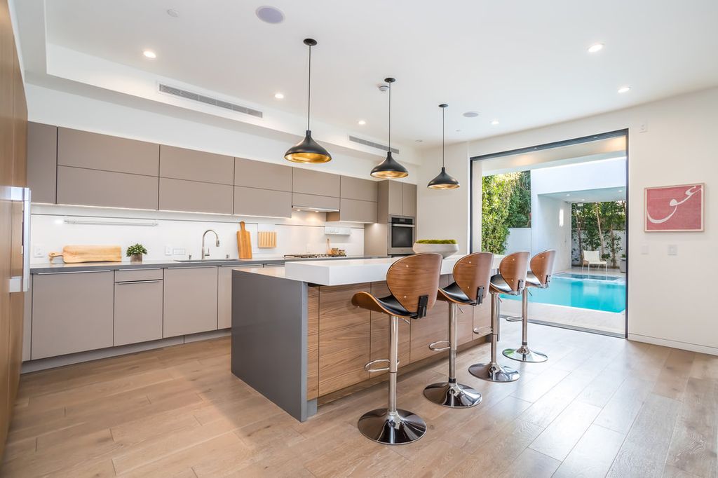 The Home in Los Angeles is a Stunning contemporary home gated for privacy on a prime street in the highly regarded Melrose Village now available for sale. This Estate located at 836 N Ogden Dr, Los Angeles