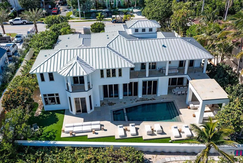 The Home in Delray Beach is sited on lushly landscaped half acre with 110+/- feet directly on the oceanfront now available for sale. This property located at 711 N Ocean Blvd, Delray Beach, Florida